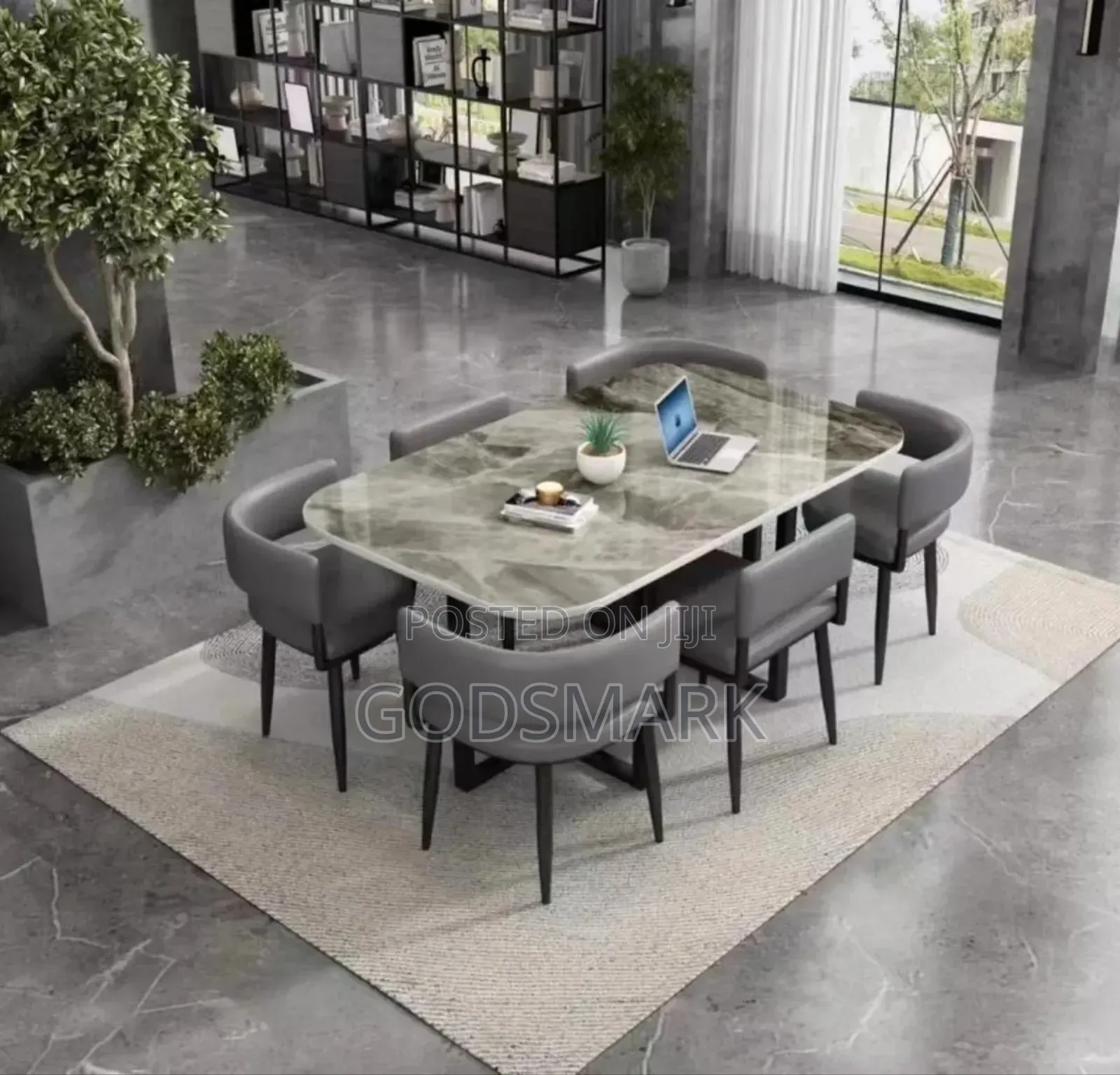 6 Seater Dining Table and Leather Seats in Grey Colour.