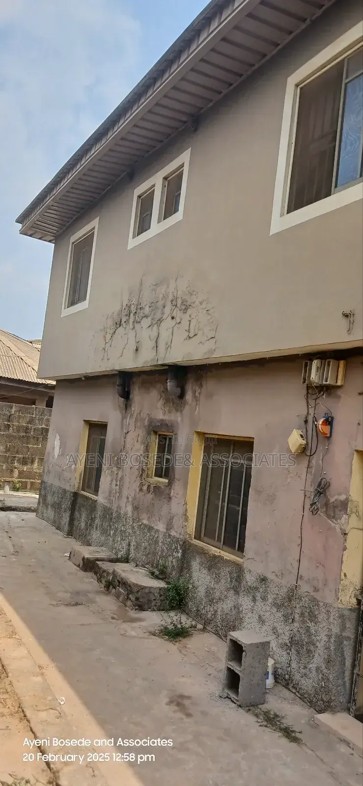 Two Buildings One Completed And The Other At Lintel Level