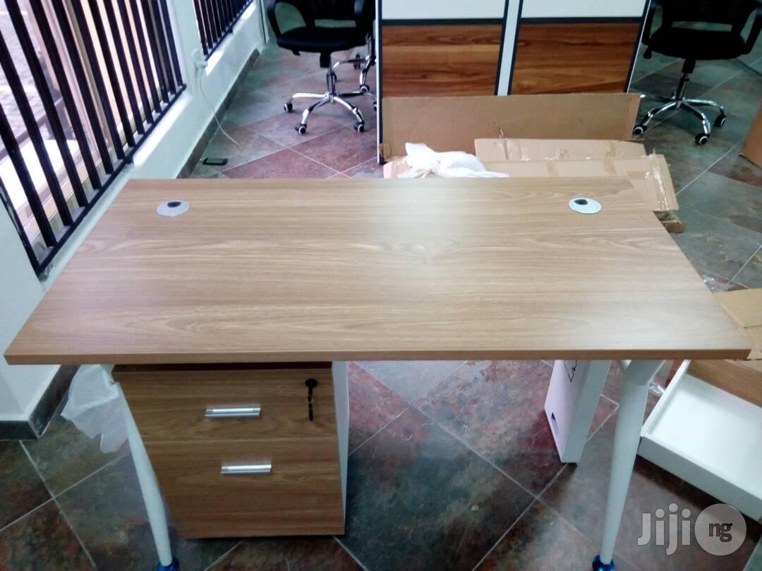 Light Brown And White Table With Mobile And Metal Legs