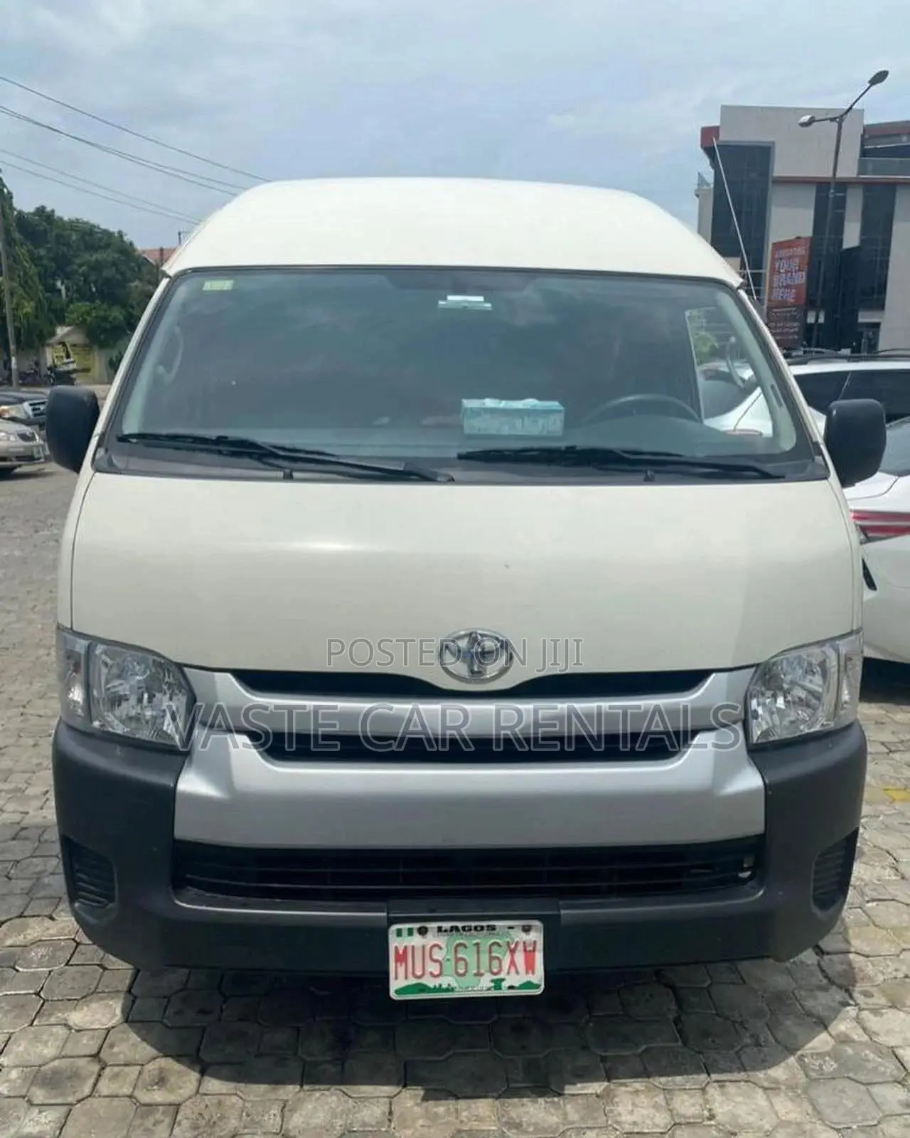 Air-Conditioned White Toyota Hiace for Rent.