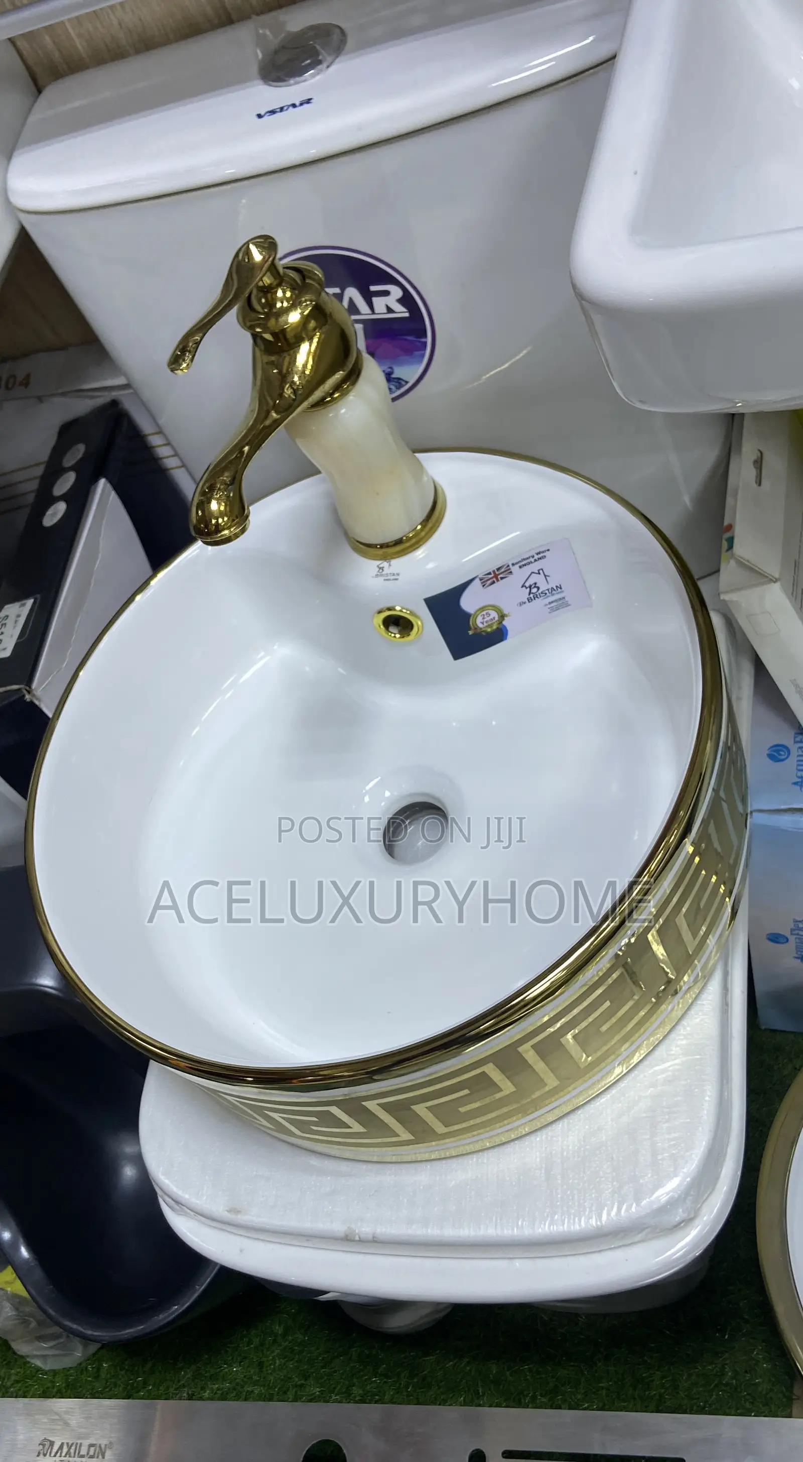 Gold and White Countertop Basin With Faucet