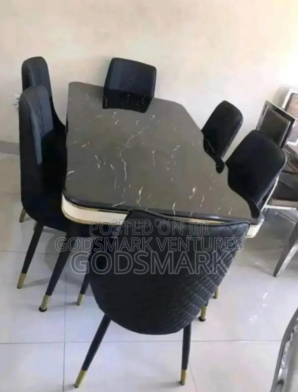 Black Marble Dining Set With Leather Seats.