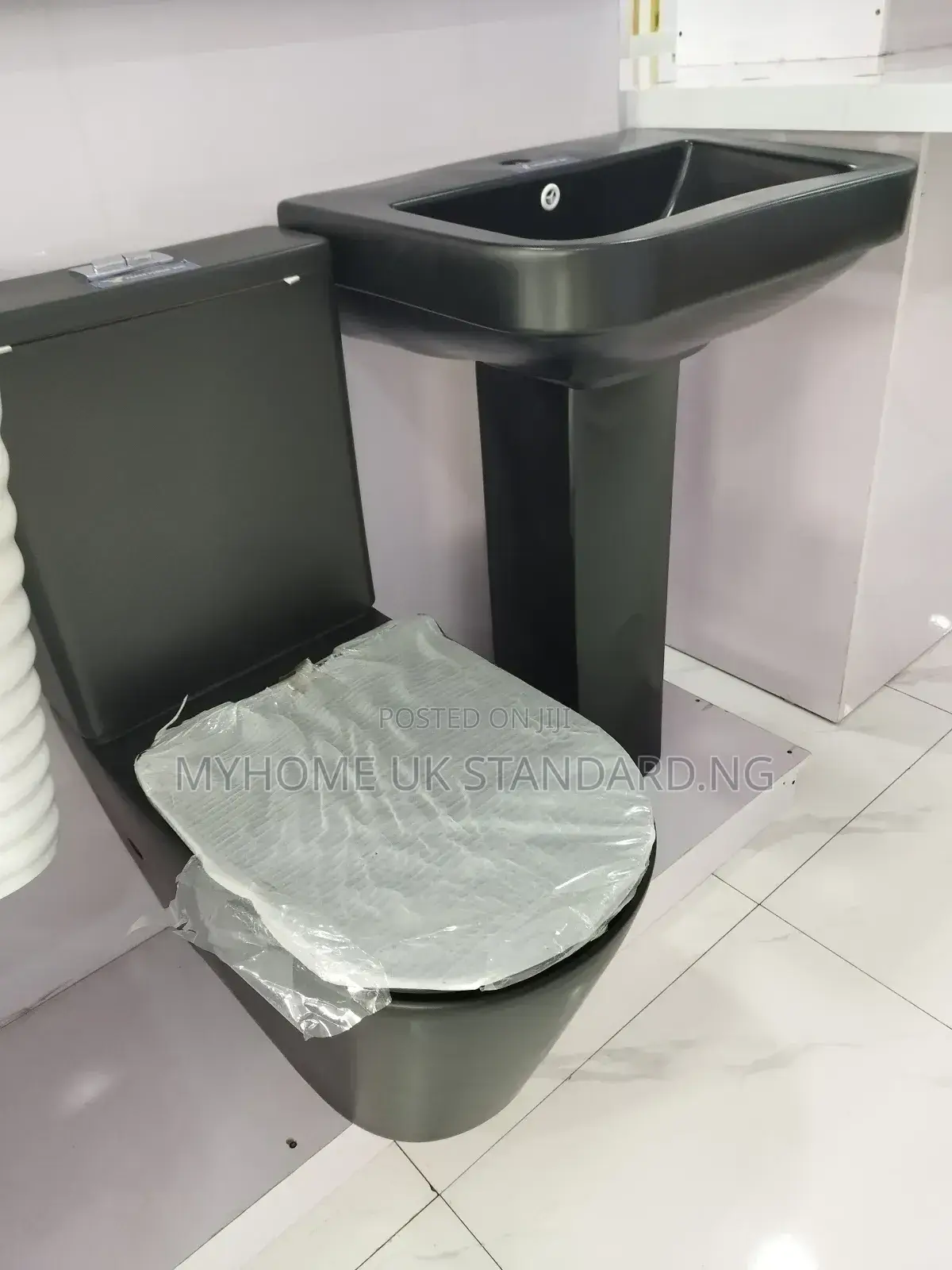 Black Water Closet  With Standing Washing Hands Basin