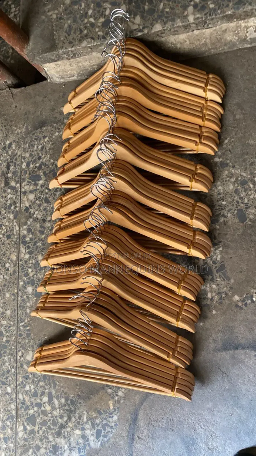 A Pack Of Neat Wooden Clothes Hangers