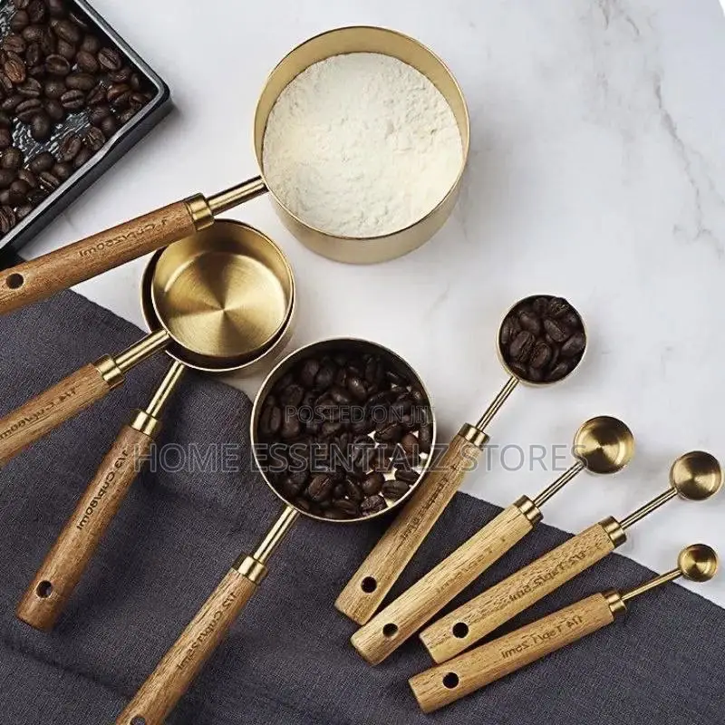 Set of Stainless Steel Measuring Cups With Wooden Handle