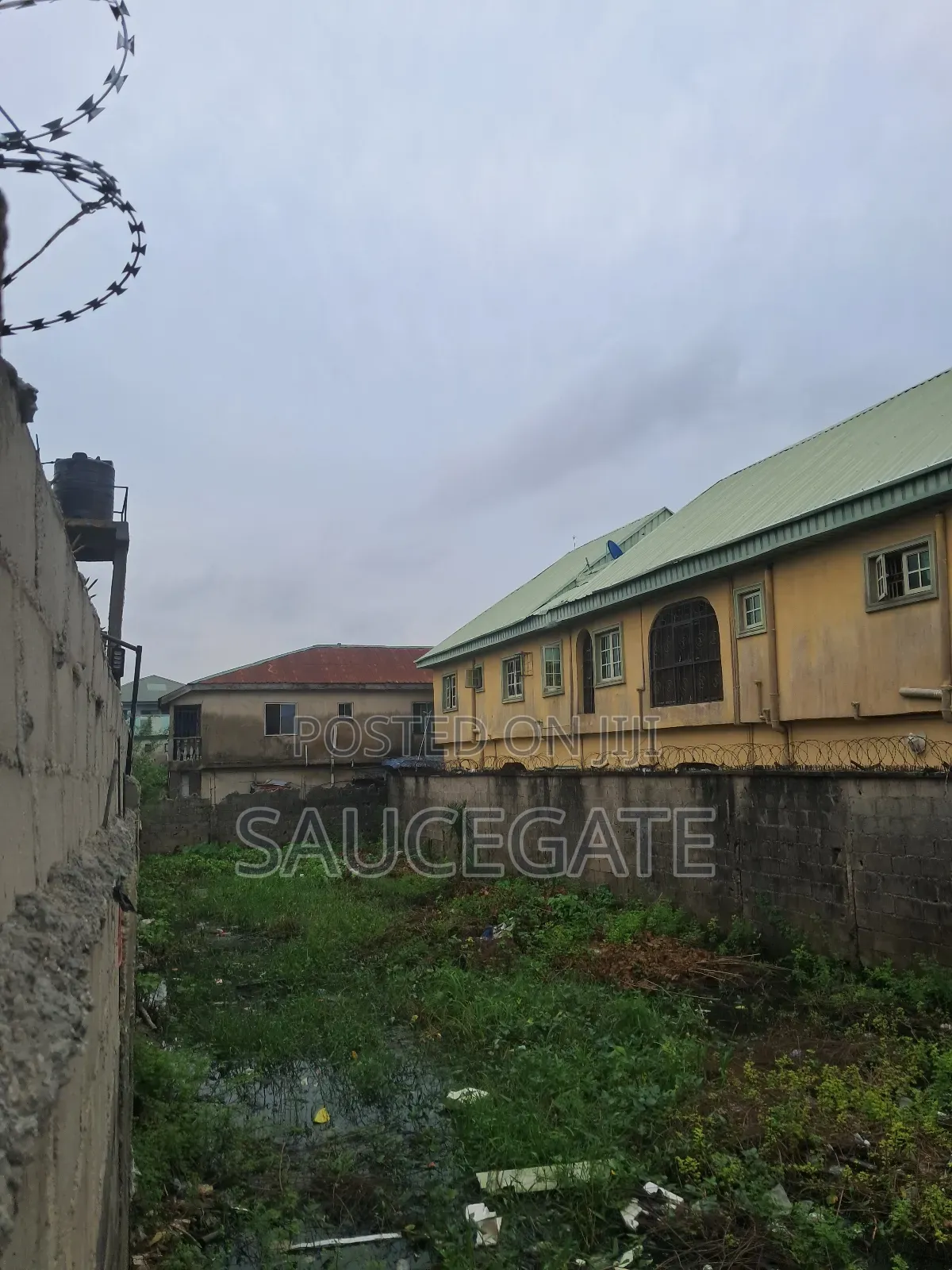 Half Plot Fenced and Gated Dry at Ijegun Satellite Good