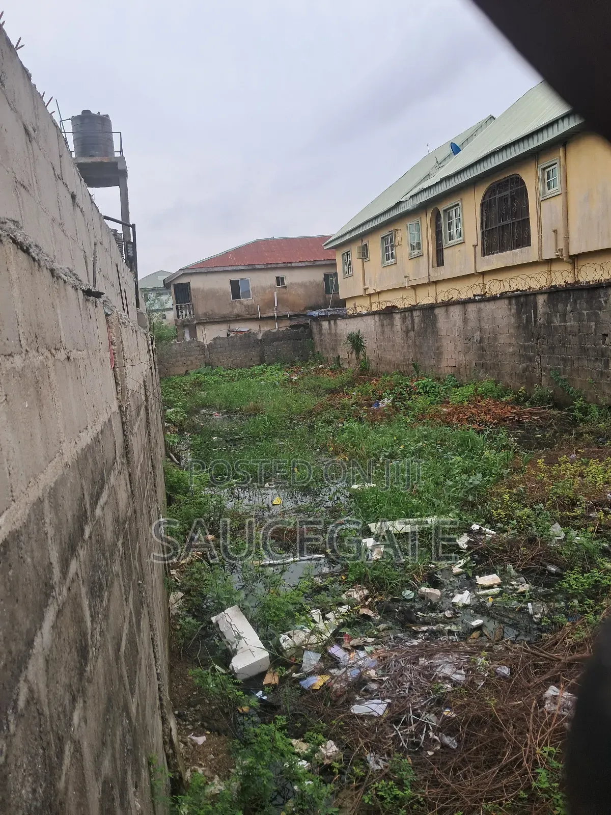 Half Plot Fenced and Gated Dry at Ijegun Satellite Good