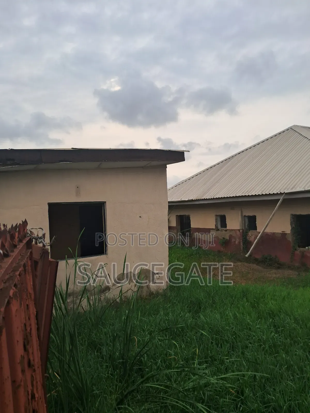 A Land With an Old Demolisbale Building at Ijegun Good Deal