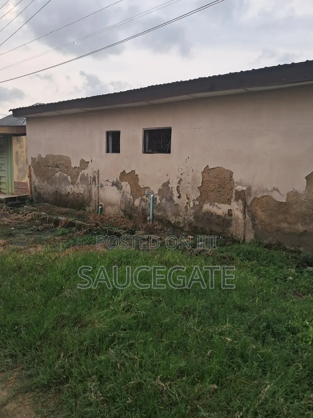 A Land With an Old Demolisbale Building at Ijegun Good Deal