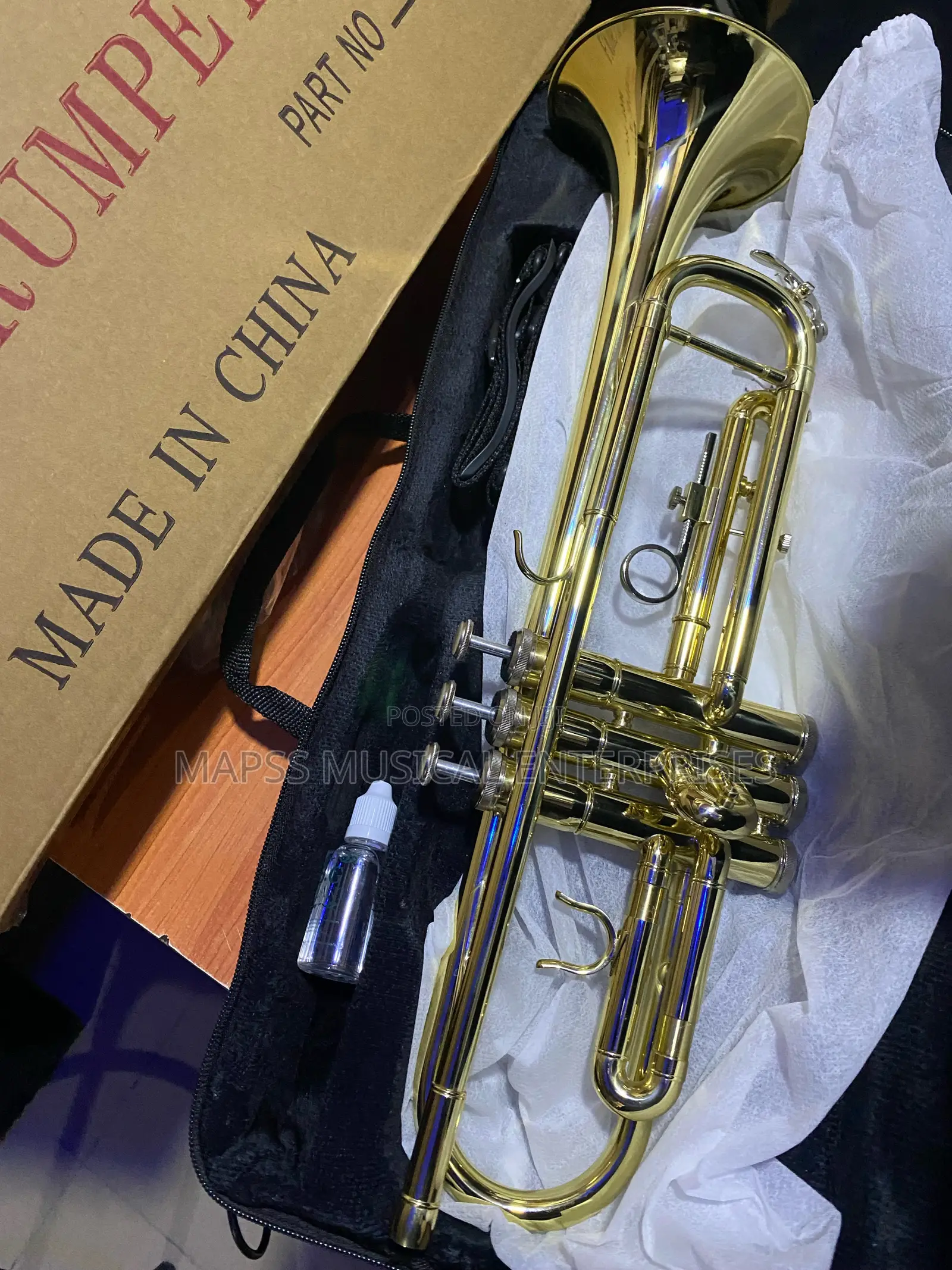 Gold-Colored Yamaha Trumpet With Accessories