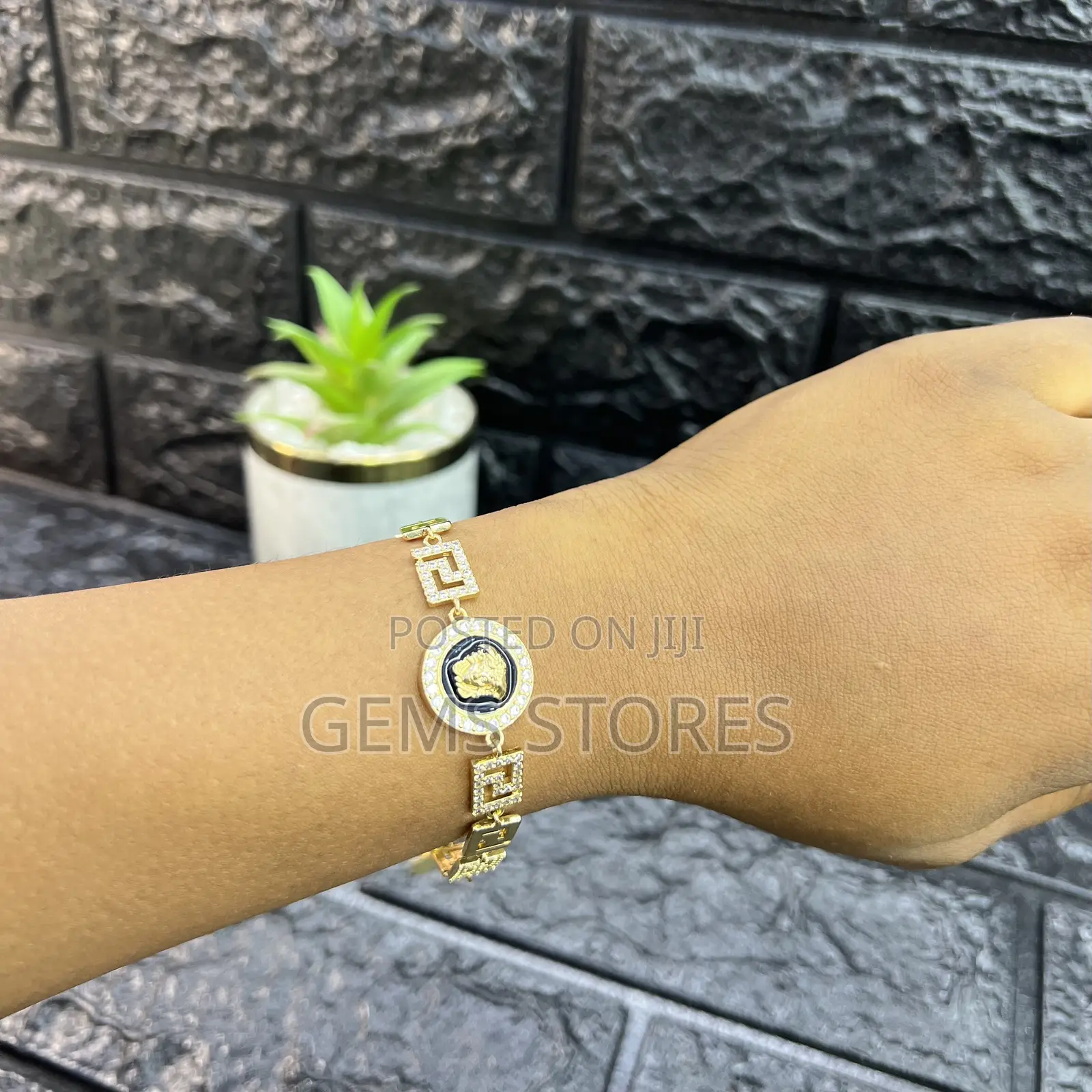 Luxurious Gold-Toned Bracelet With Medusa Medallion Crystal Details