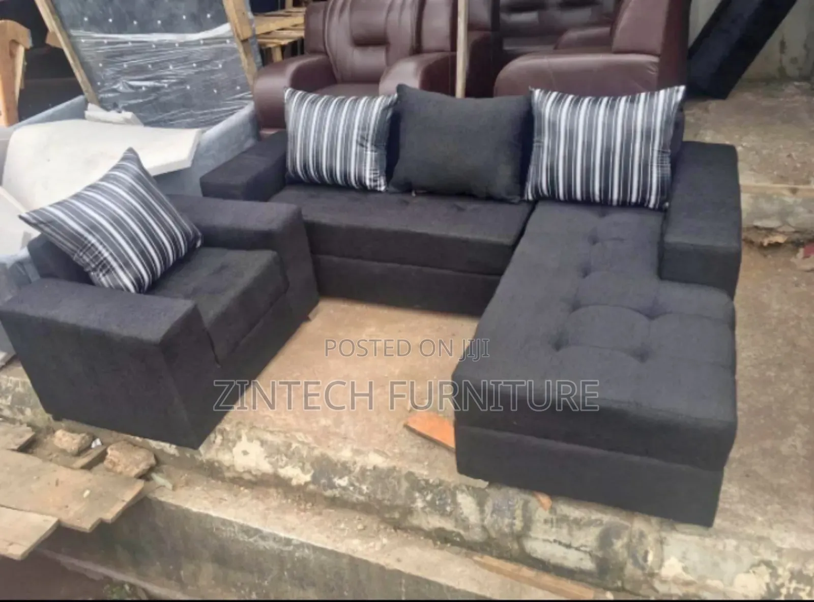 Classy and Well Furnished Black L Shape Sofas and a Single Seater