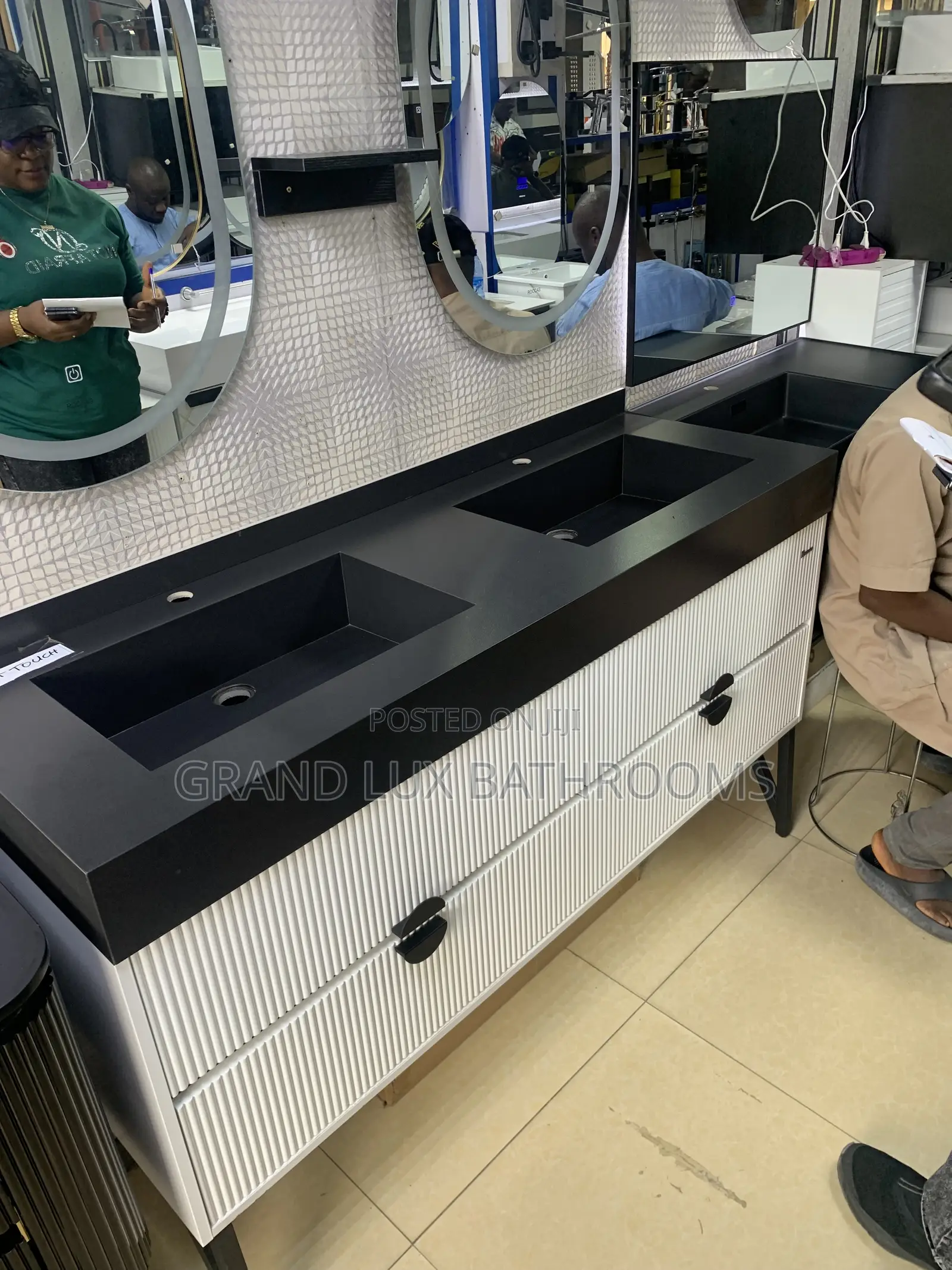 **Modern Double Sink Vanity With Oval Mirrors and Textured Wall Finish