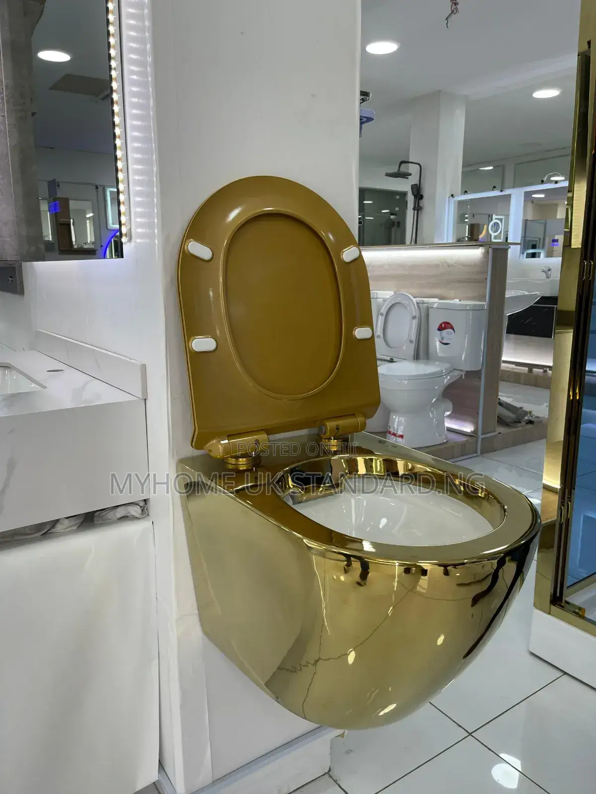 Gold And White Wall Hung Water Closet With Tank