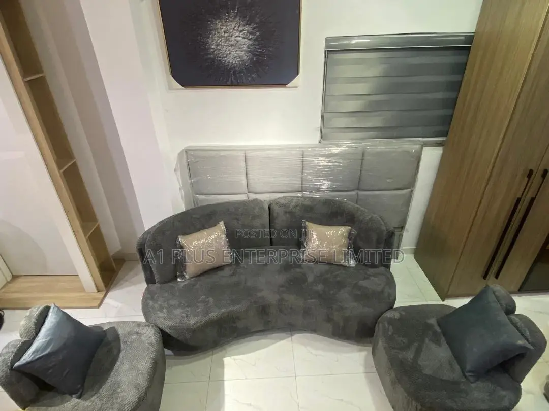 A Modern Wave-shaped Sofa Set In Plush Grey Fabric