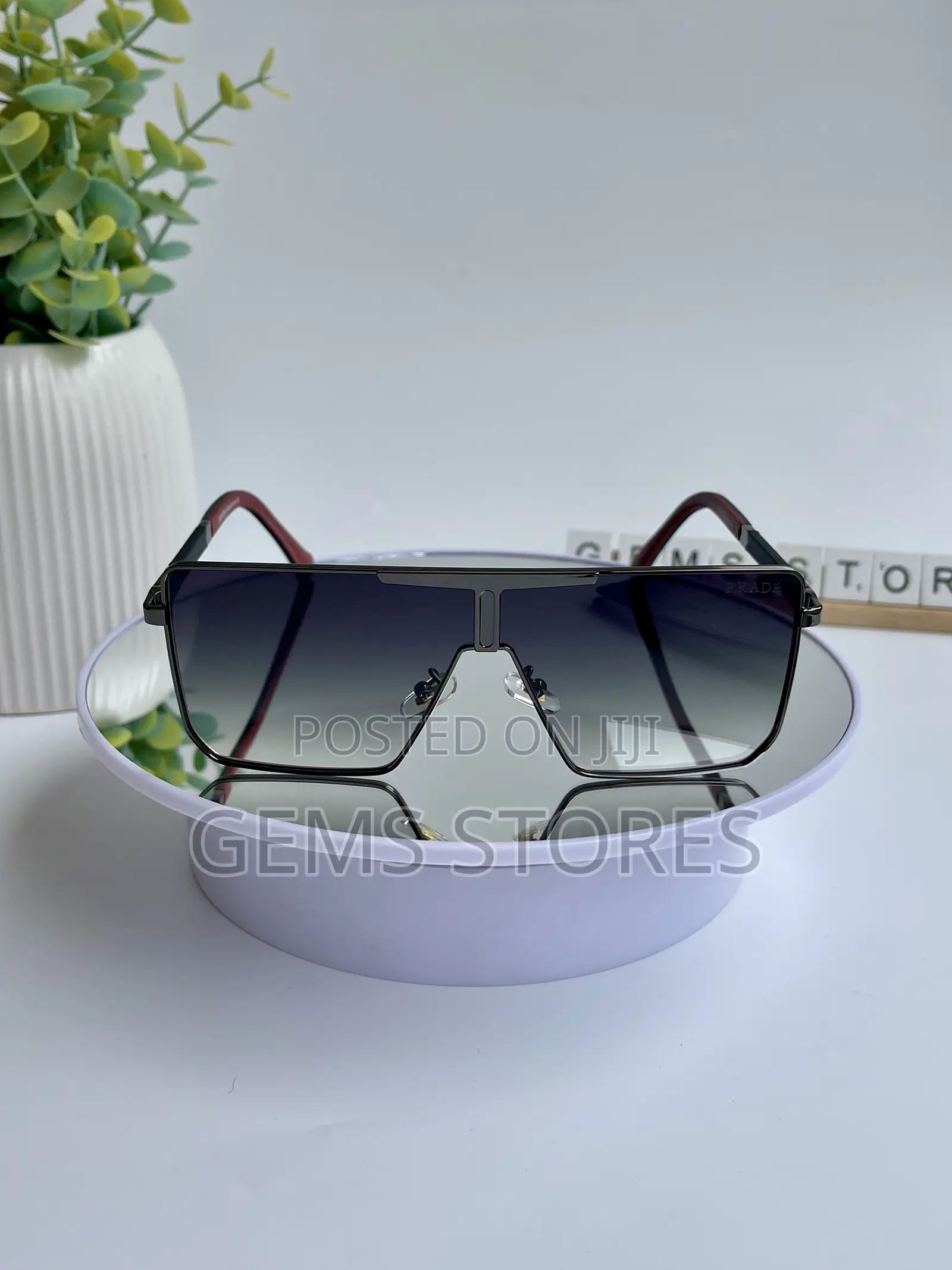Stylish Prada Aviator-Style Sunglasses - Black Red Tones