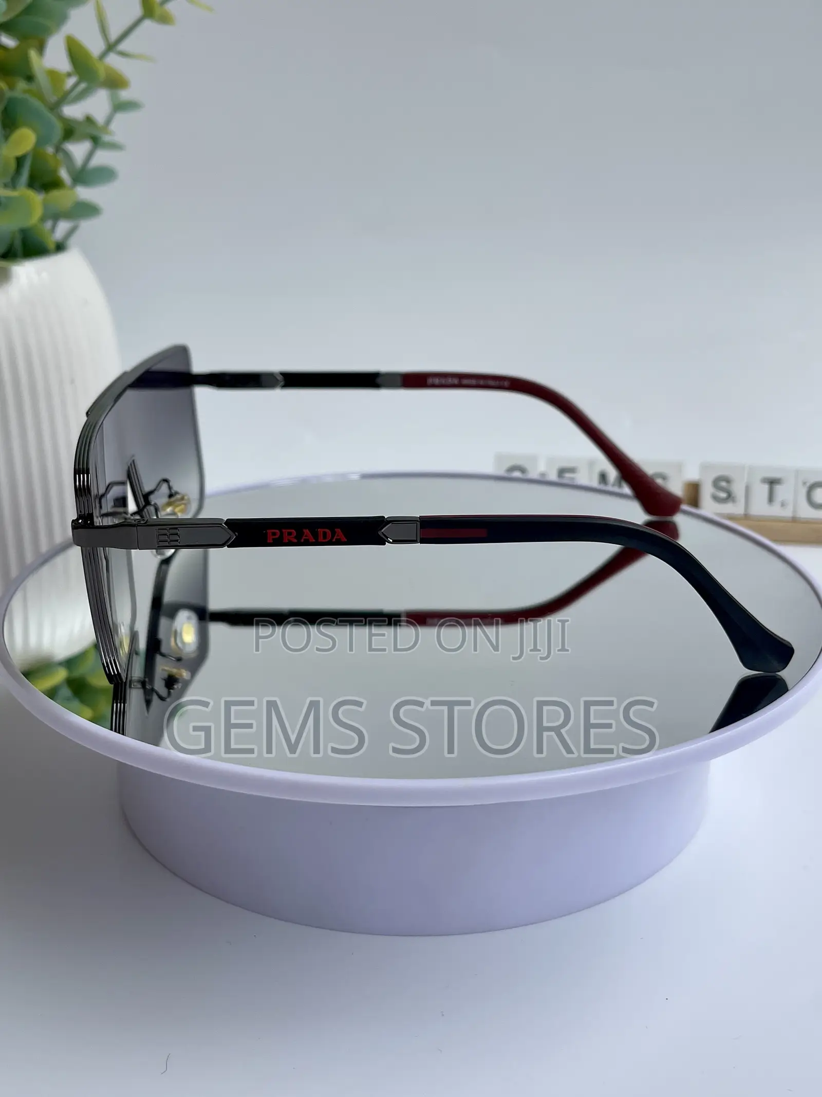 Stylish Prada Aviator-Style Sunglasses - Black Red Tones