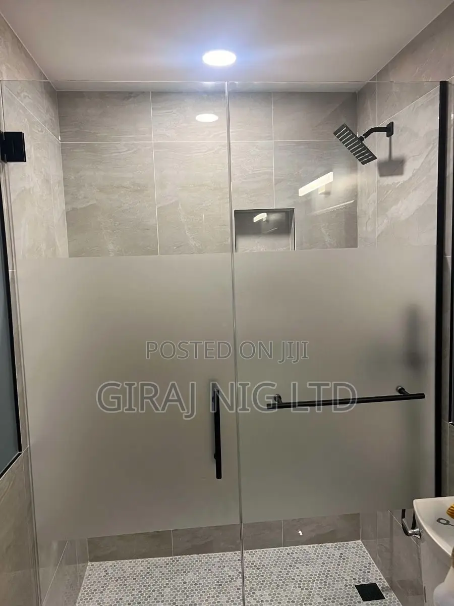 Single Shower Doors With Black Hardware and Frosted Glass