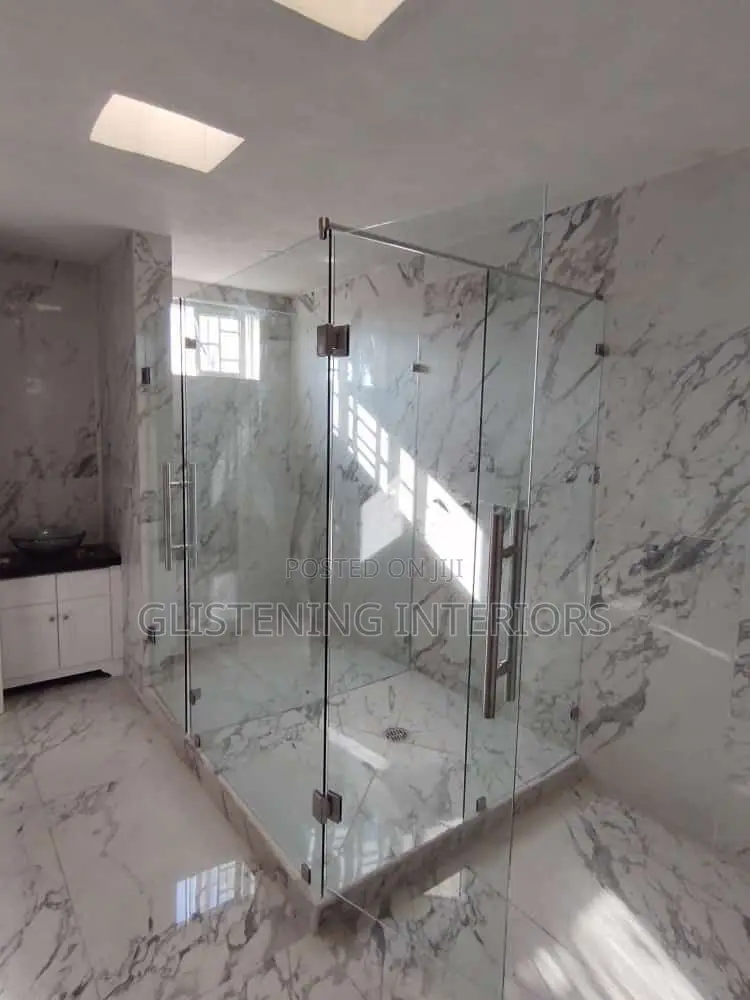 Shower Cubicle Hung Design With A Silver Accessories,