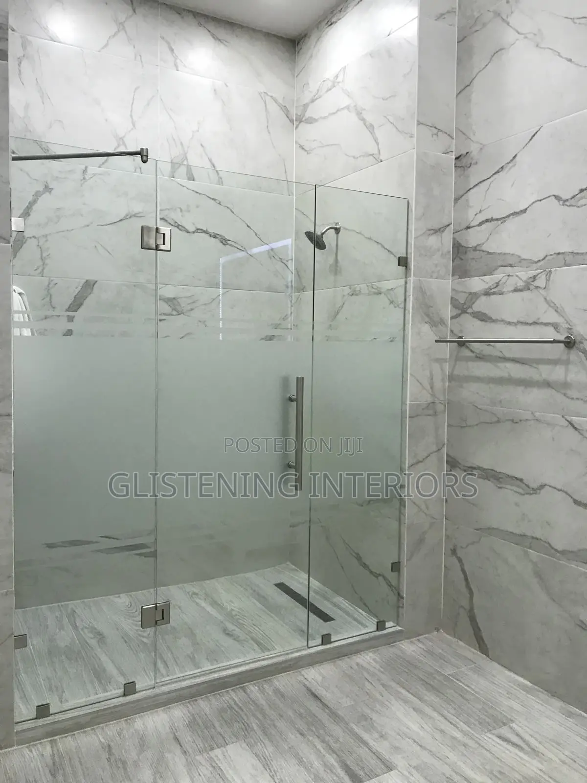 Shower Cubicle Hung Design With A Silver Accessories,