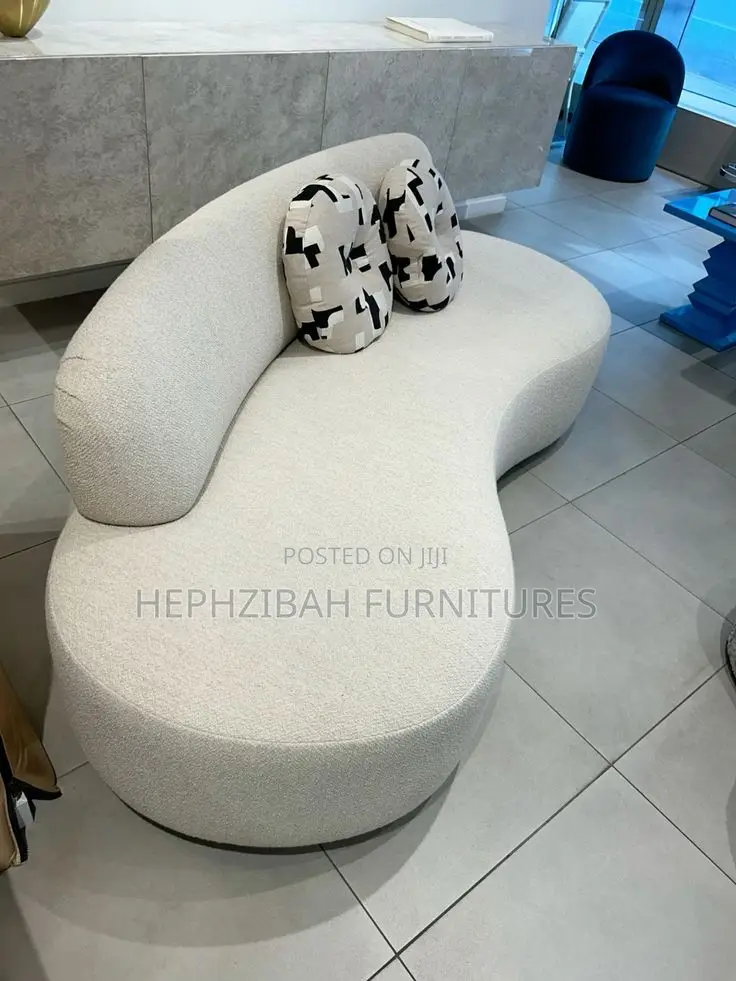 Cream Curve Sofa With Throw Pillow