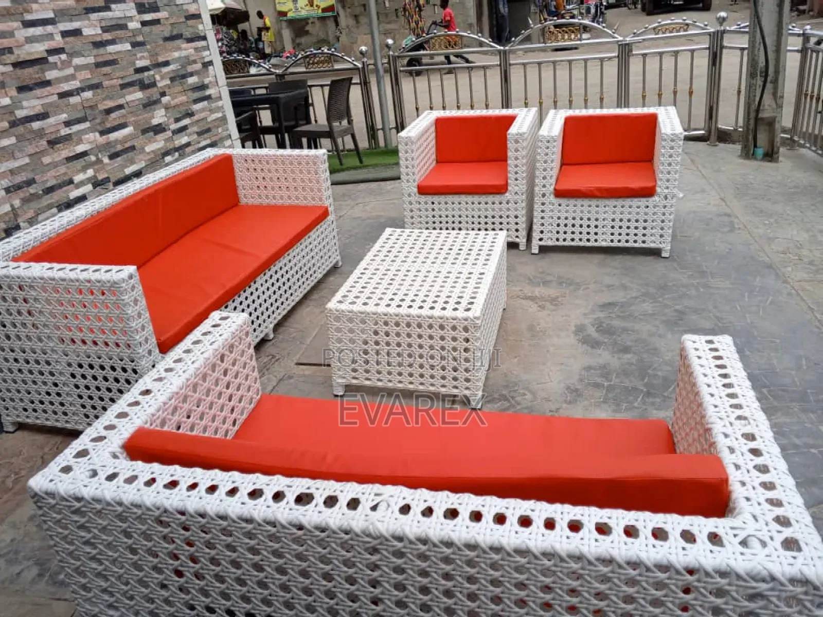 Outdoor White Rattan Chair With Red Cushion