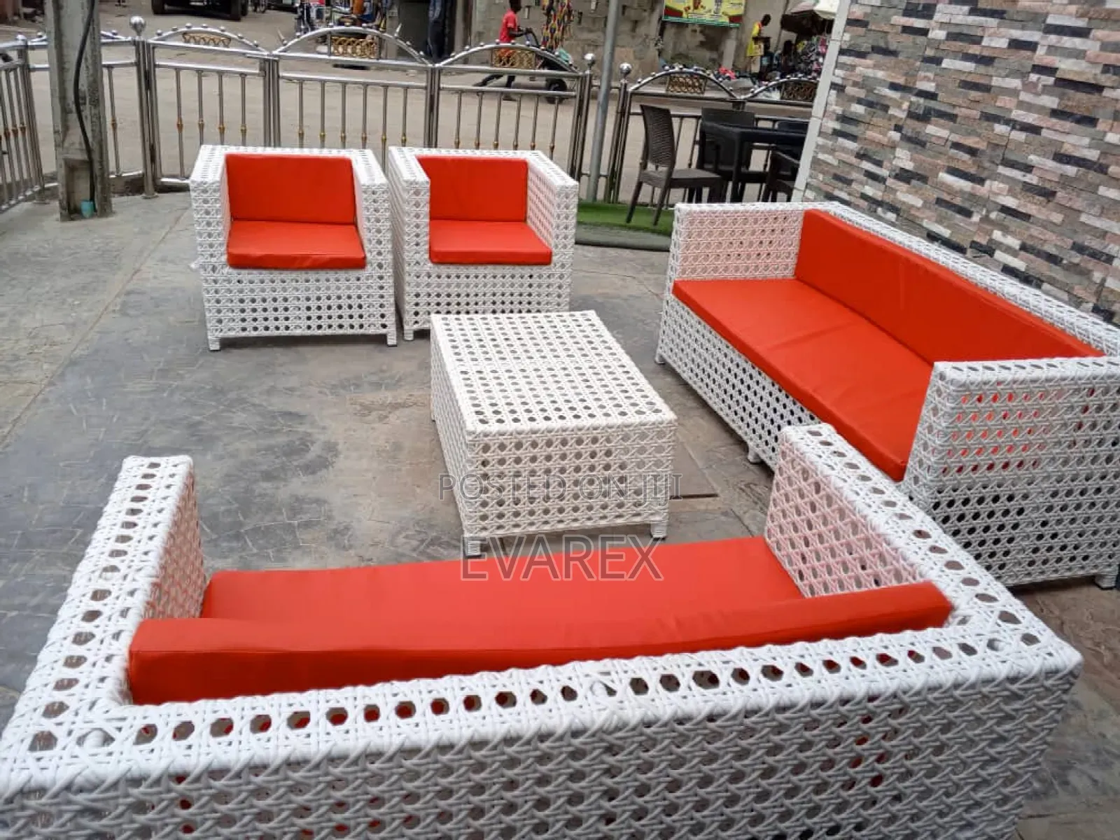 Outdoor White Rattan Chair With Red Cushion