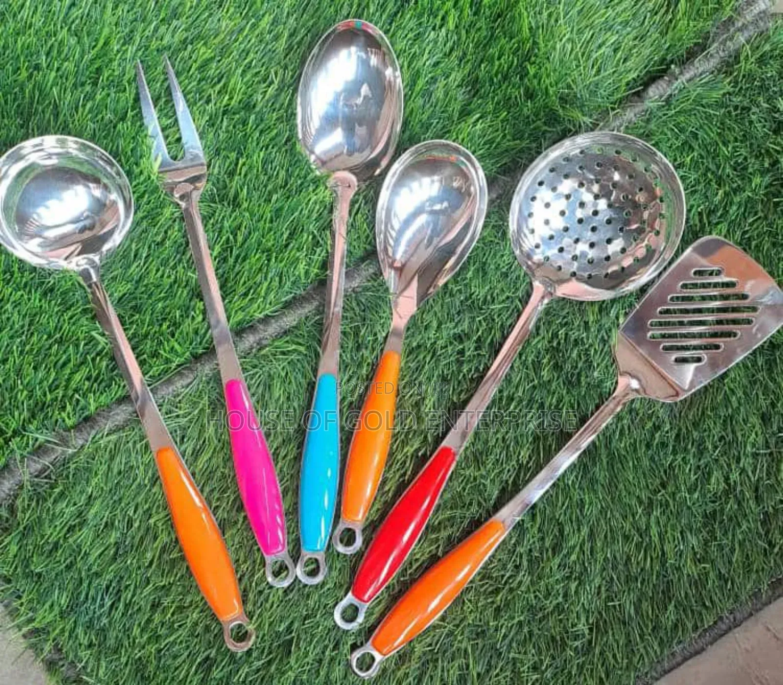 Set of Stainless Steel Kitchen Cooking Utensils With Colorful Handles.