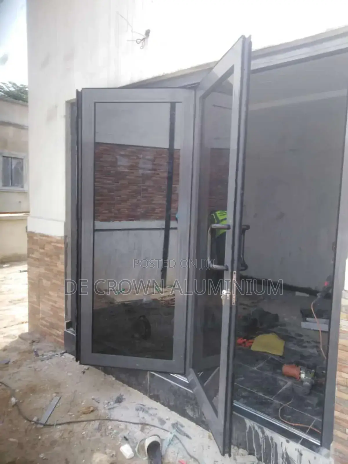 Luxury Aluminium Collapsible Door With Grey Glass Durable Space Saver.