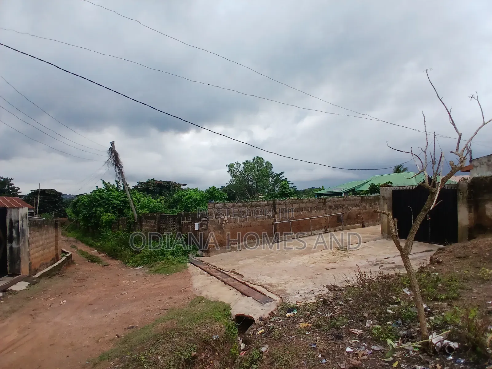 14,233.385sqm Fenced Land With Structures for Sale at Awoton