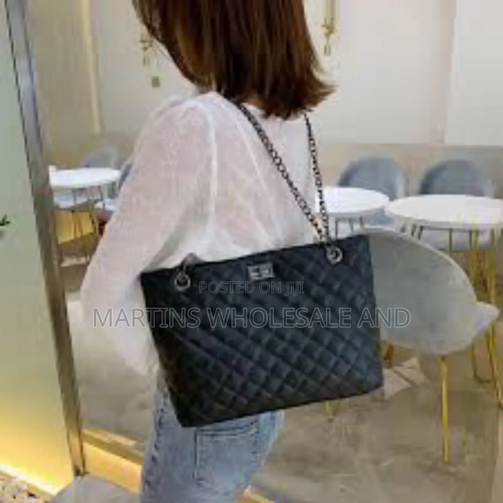 Quilted Black Handbag With a Metal Chain Strap