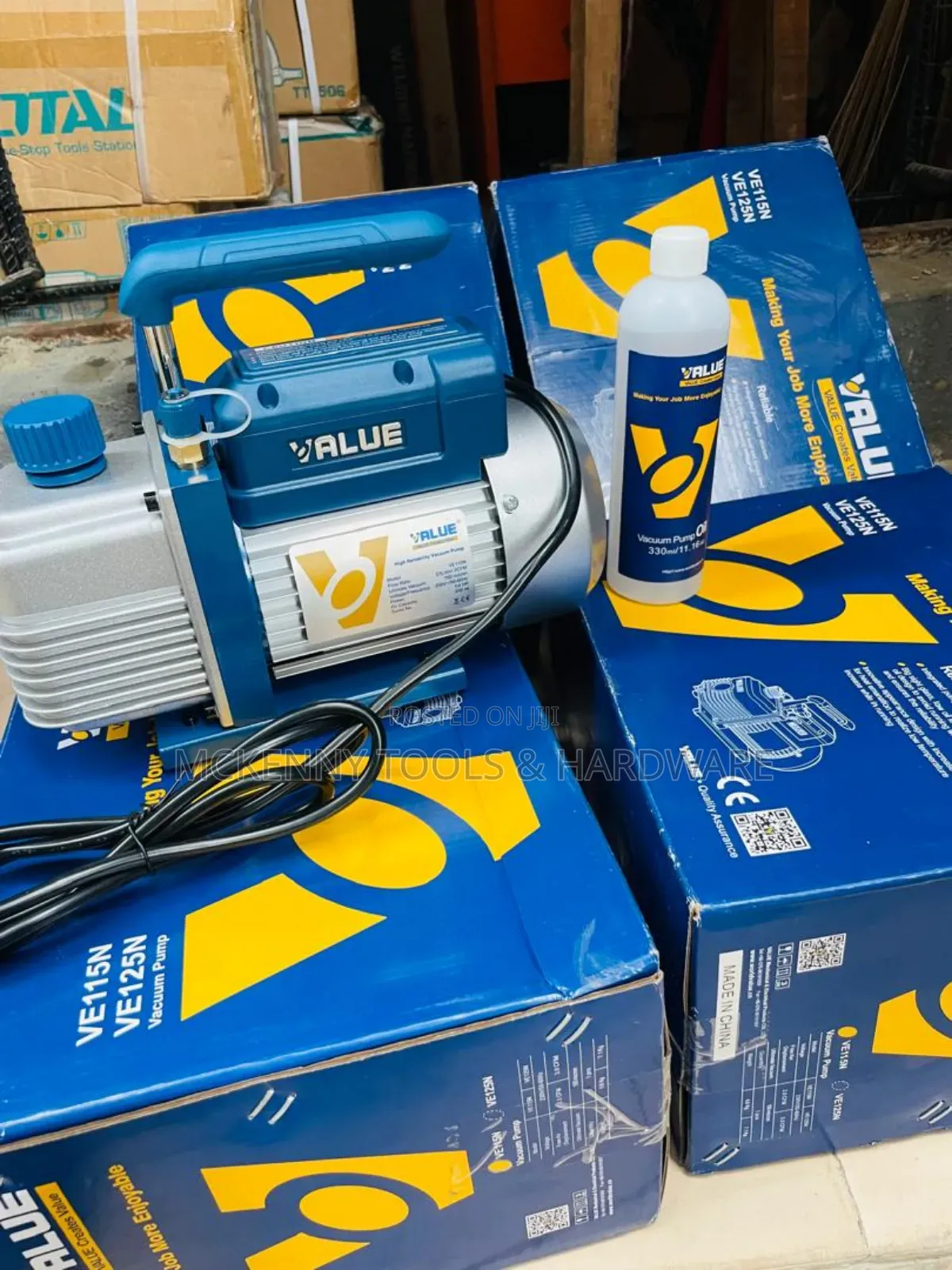Value Ve115n Vacuum Pump, Along With a Bottle of Vacuum Pump Oil,