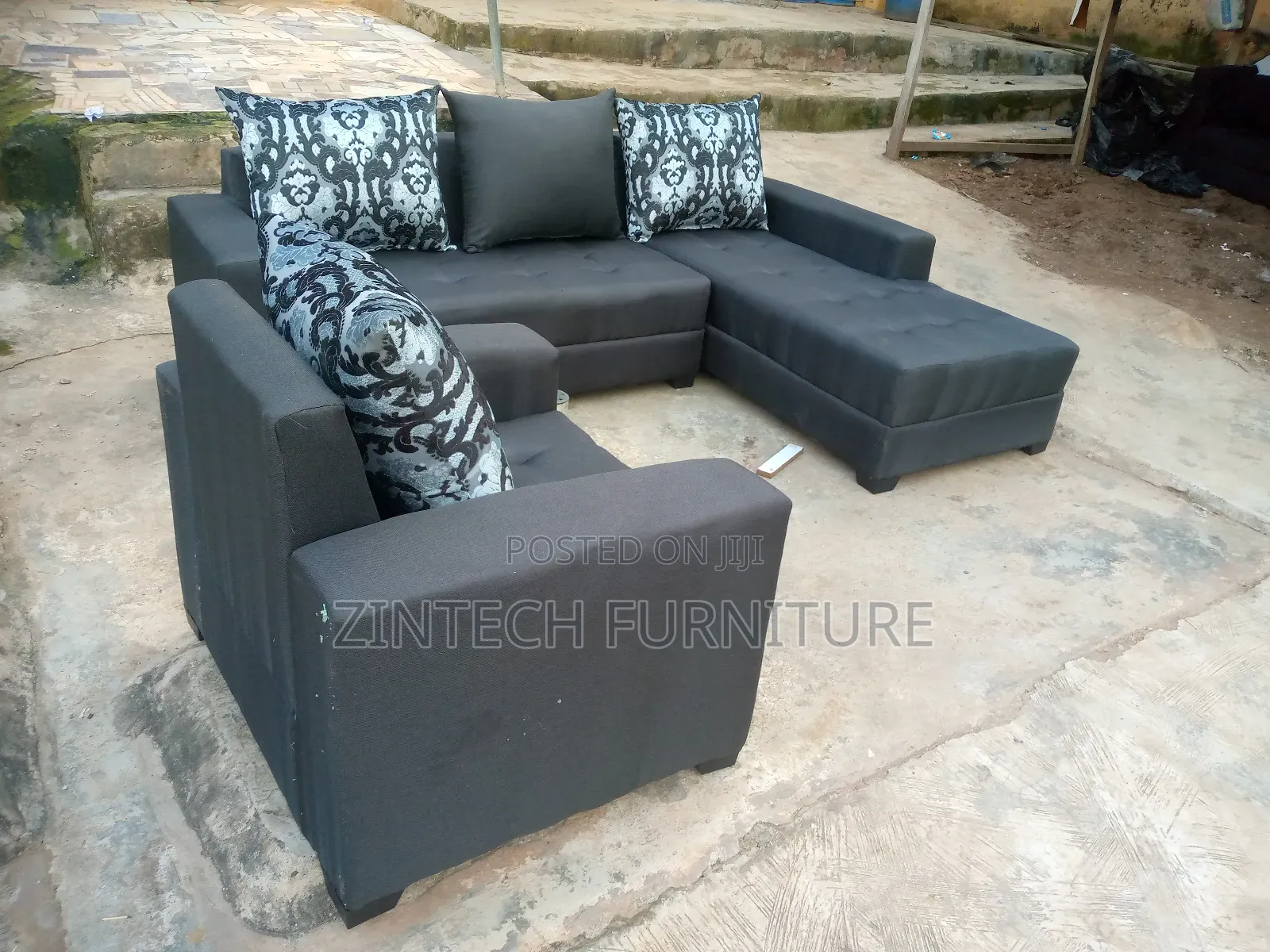 Dark Grey L Shape Couch and a Single Seater