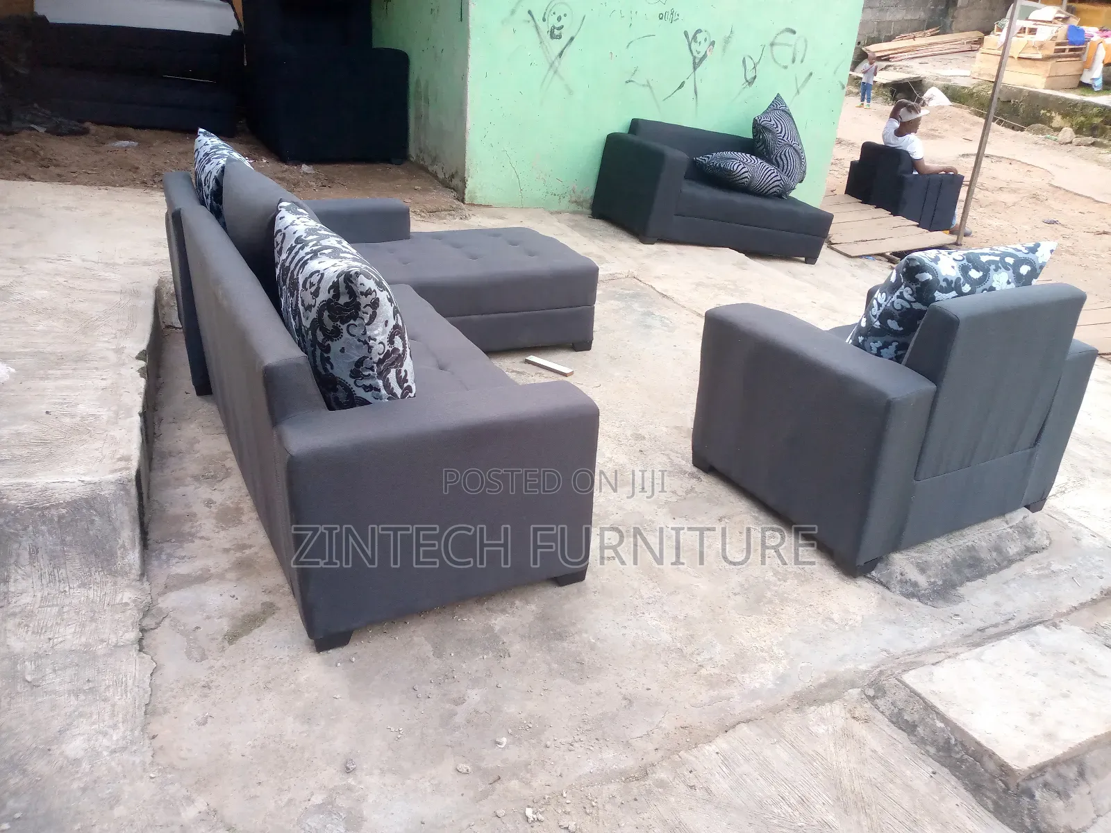 Dark Grey L Shape Couch and a Single Seater
