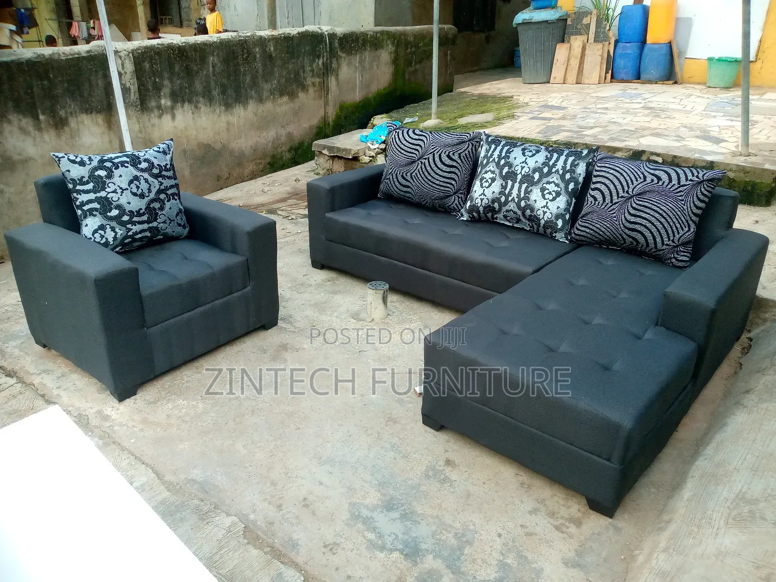 Gray L Shape Sofas and a Single Seater With Pillows