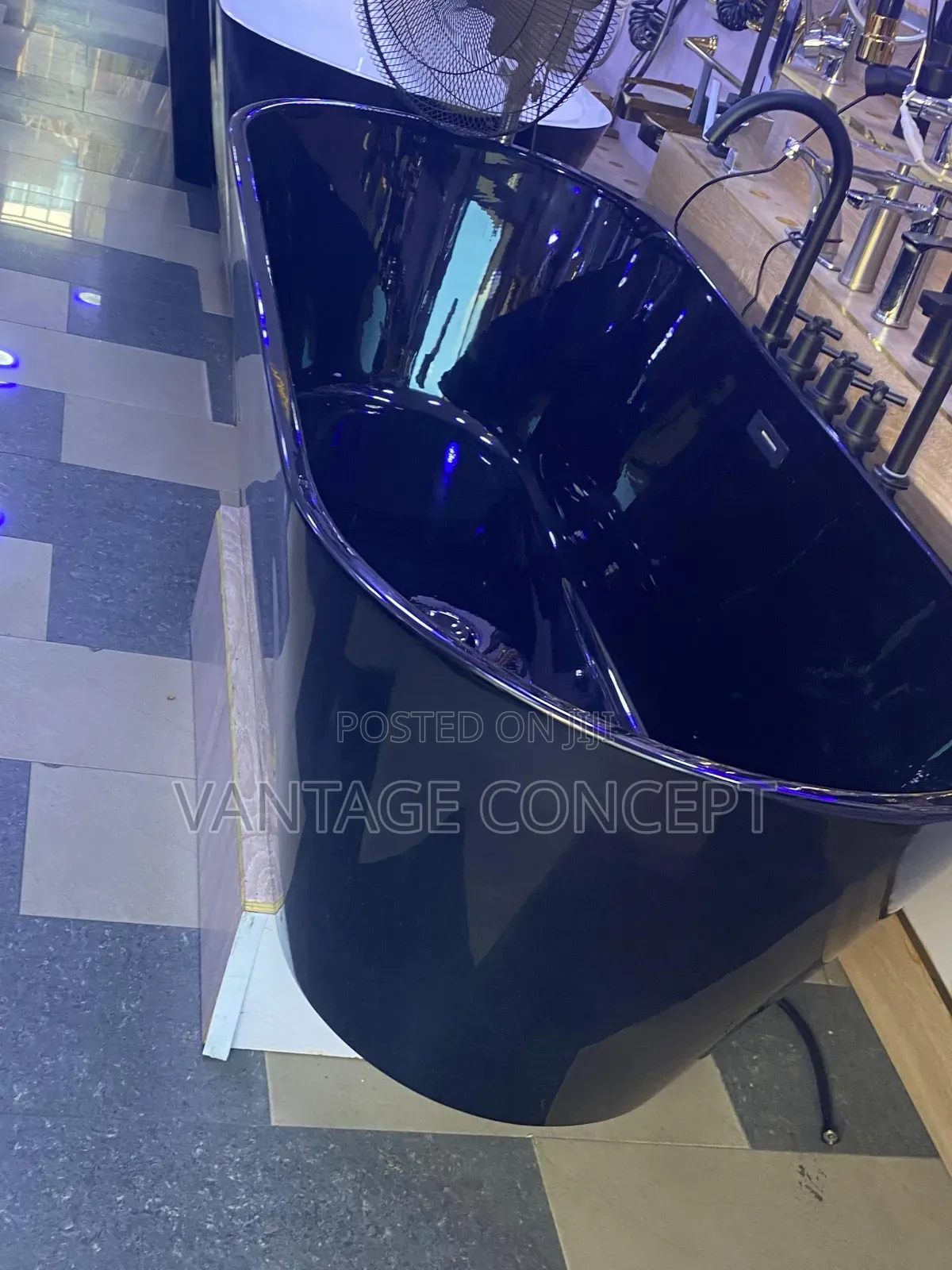 Black Bathtub With Inbuilt Mixer Tap.