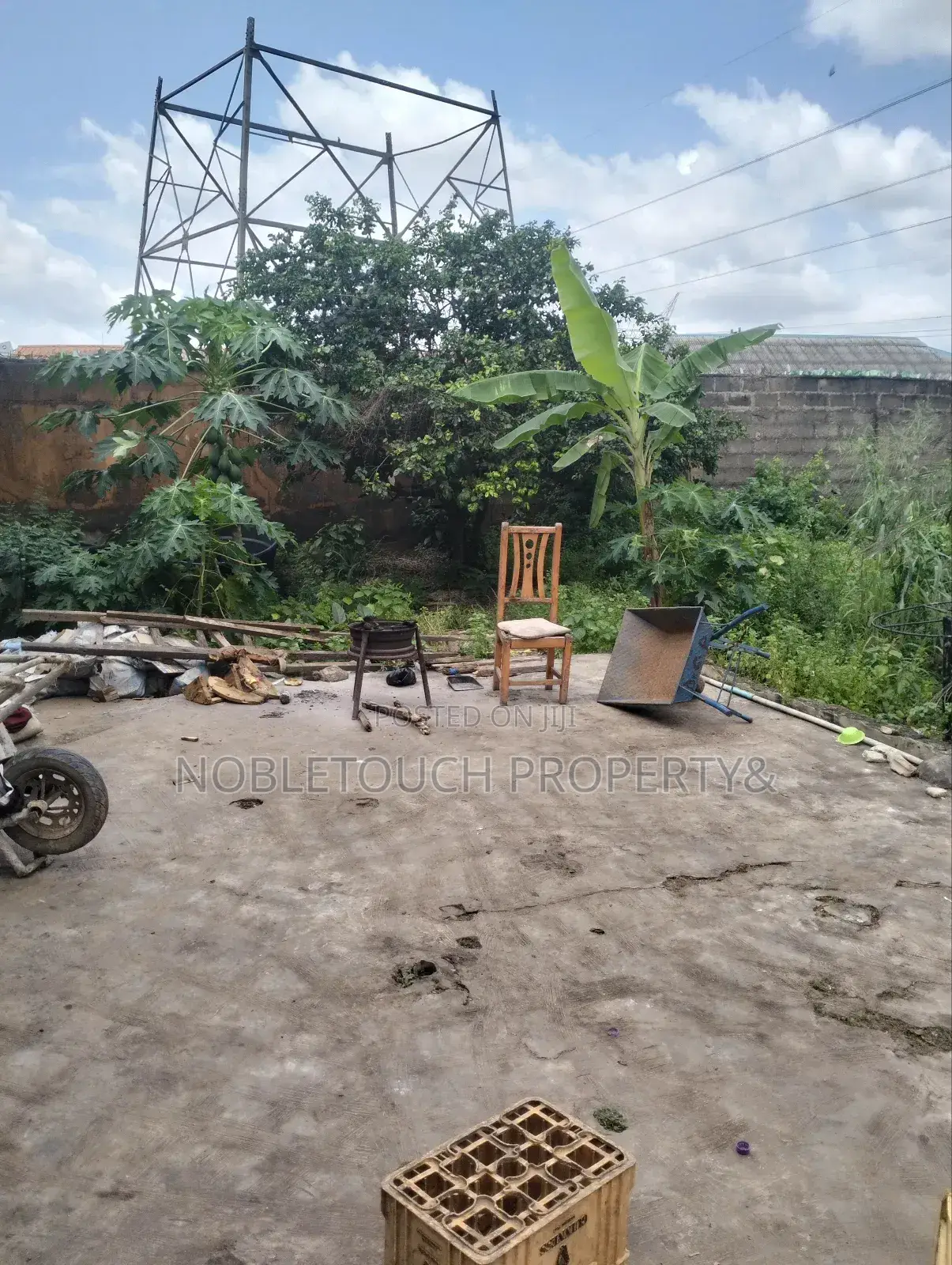 Dry Table Land With 4-Shops at Oluwaga Ipaja Ayobo Lagos