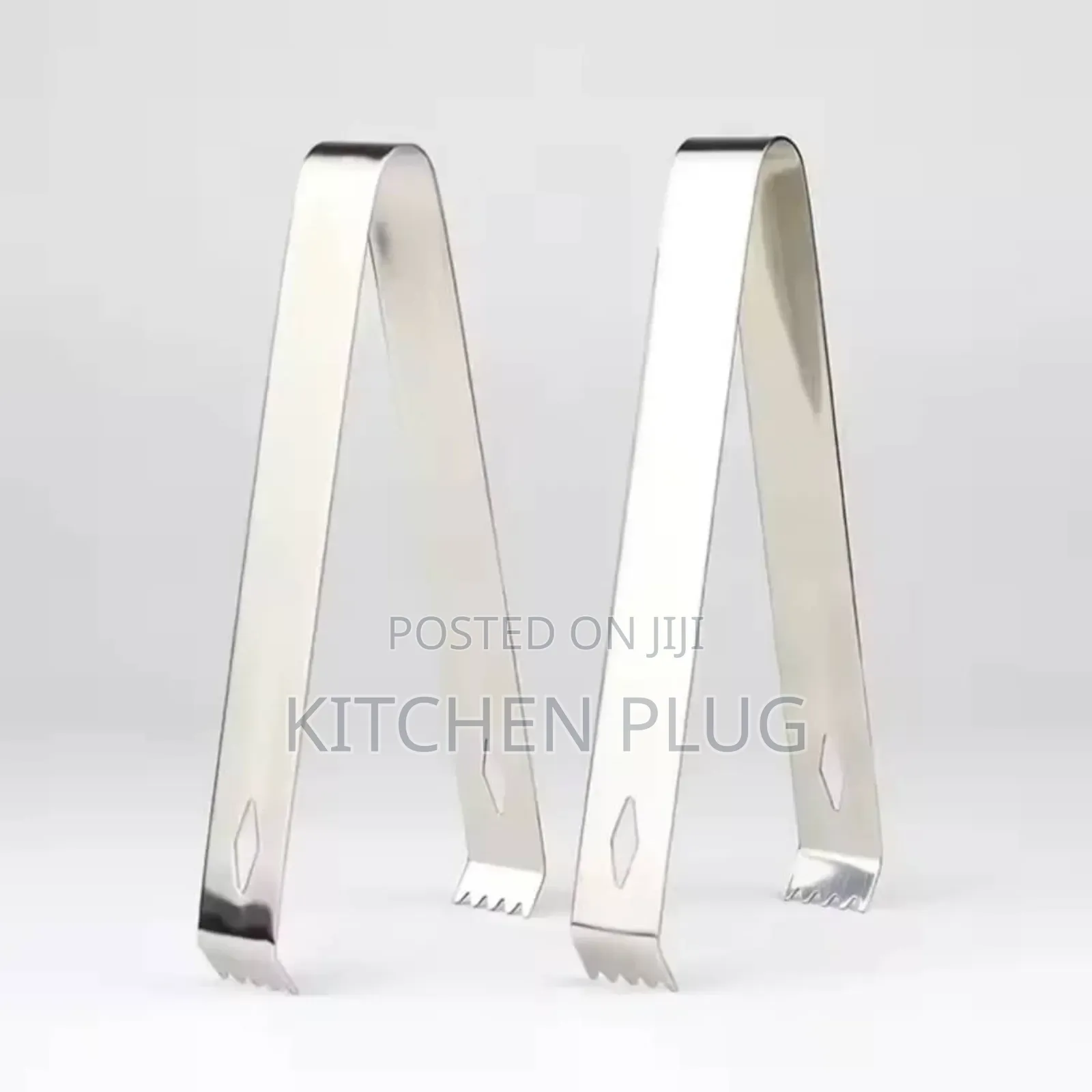 A Pair Of Stainless Steel Ice Tong
