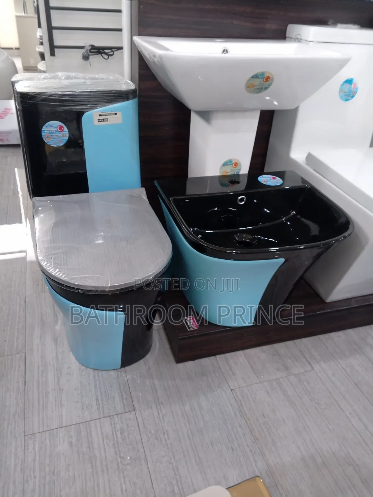 Unique Black and Blue Water Closet With Wallhung Basin