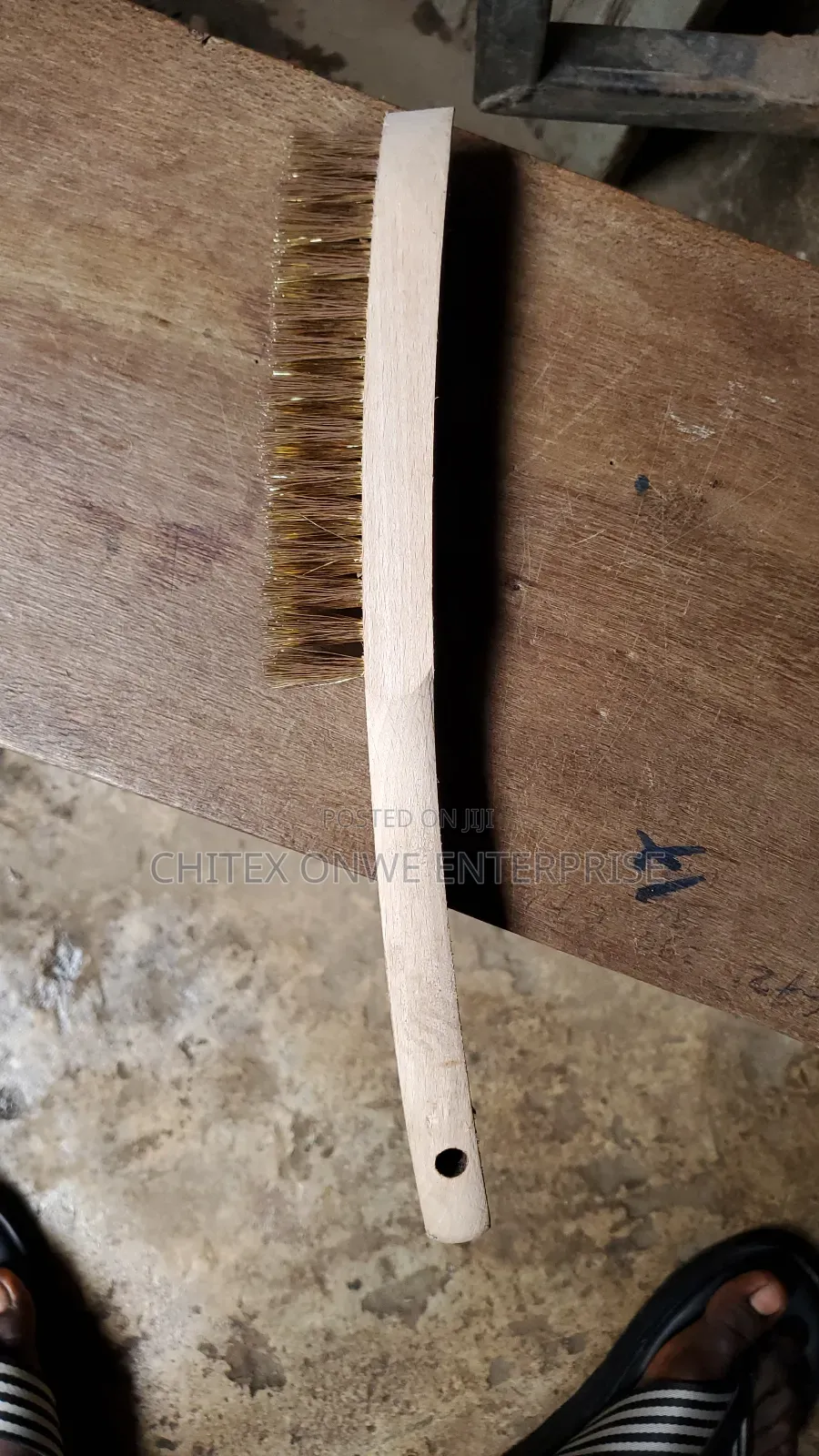 Wire Brush With Brass Bristles And A Wooden Handle.