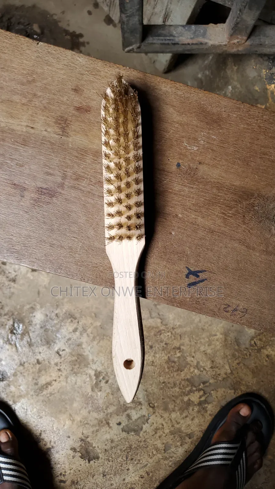 Wire Brush With Brass Bristles And A Wooden Handle.