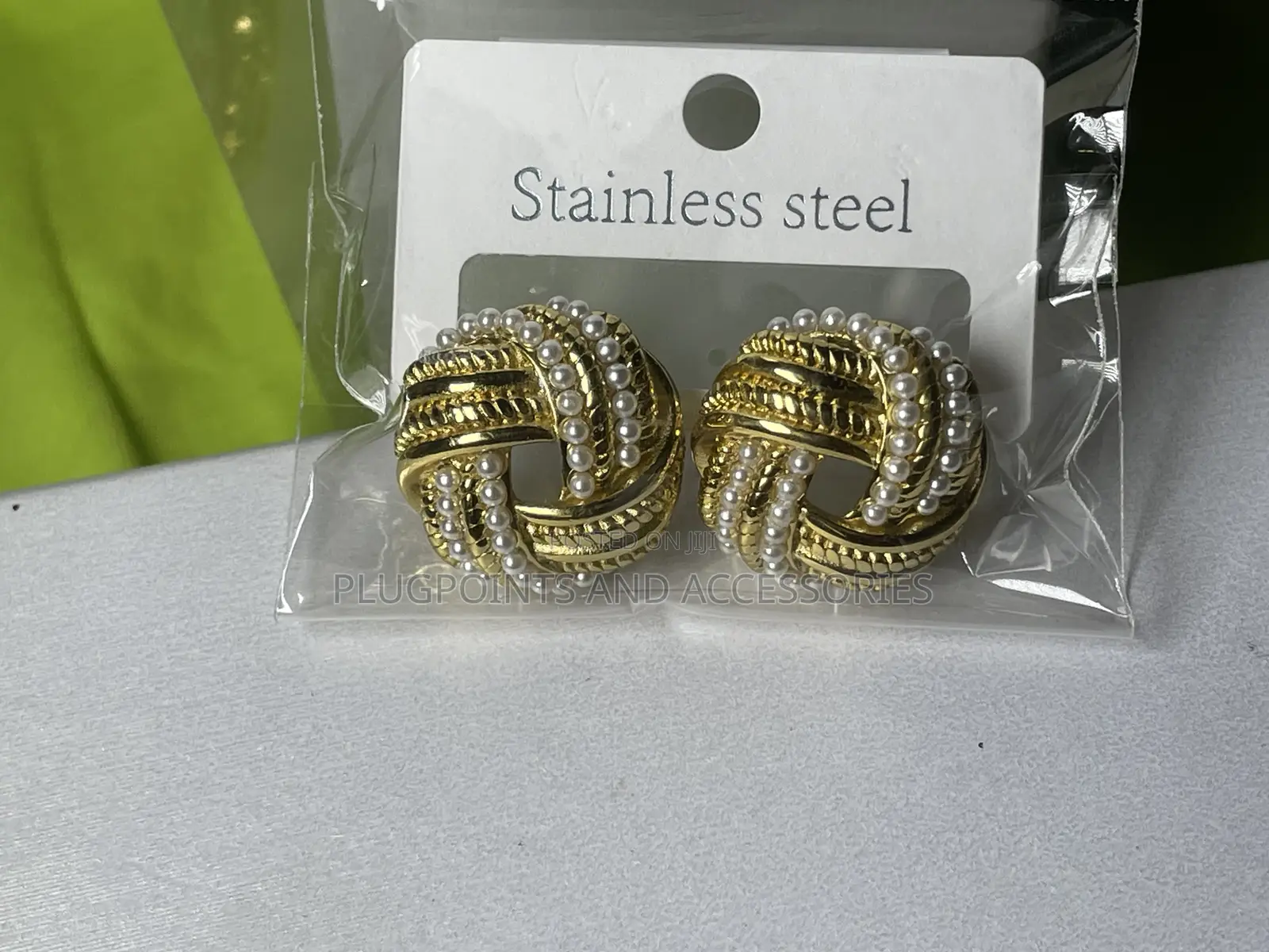 Round Twisted White Pearl and Gold Steel Embellished Earrings