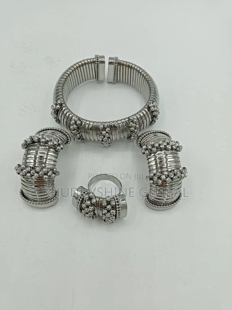 Set Of Costume Jewelry, Cuff Bracelet, A Ring, And Two Ear Cuffs