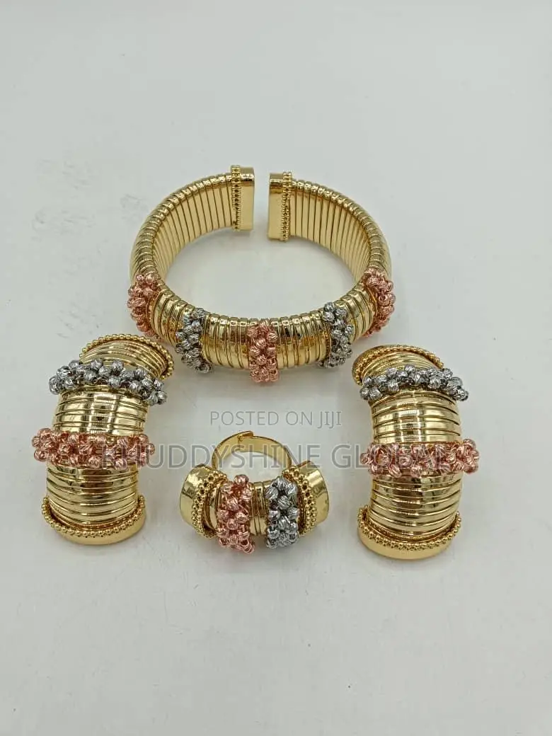 Set Of Costume Jewelry, Cuff Bracelet, A Ring, And Two Ear Cuffs