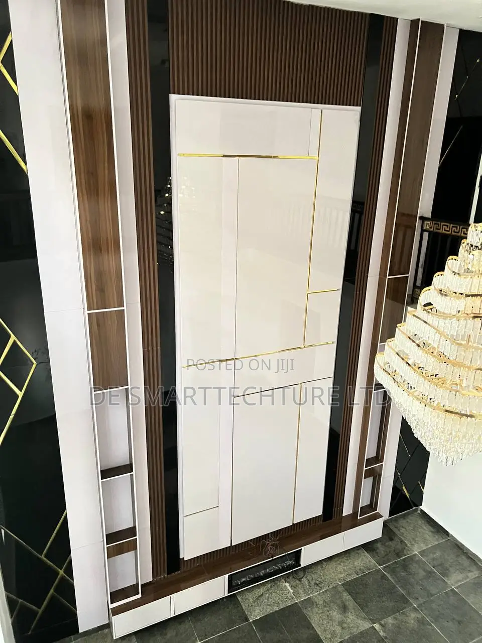 Double-Height Tv Wall Console With Integrated Paneling Gold Accents