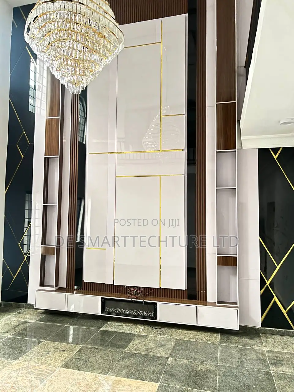 Double-Height Tv Wall Console With Integrated Paneling Gold Accents