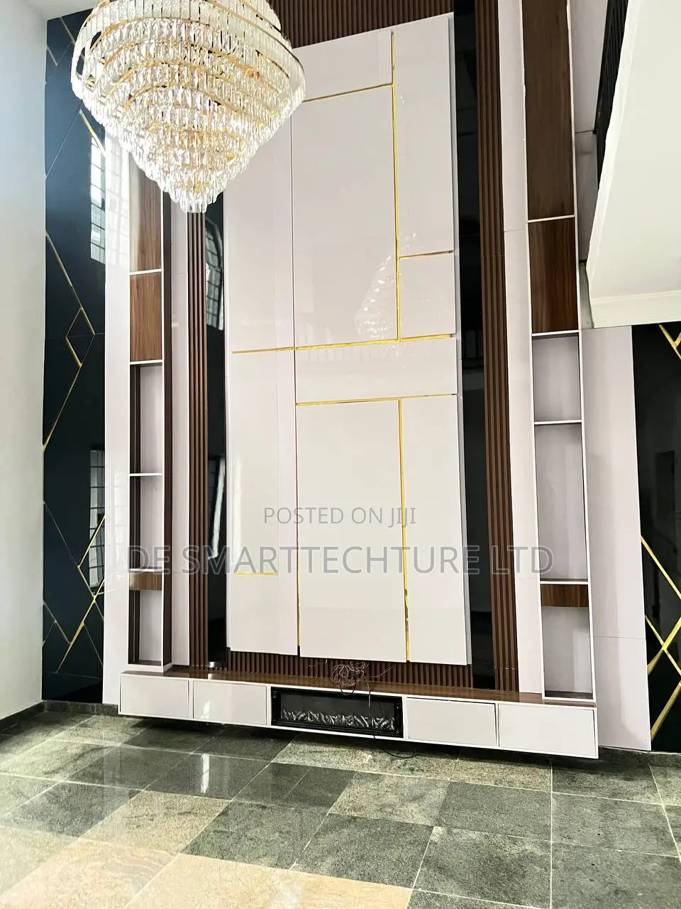 Double-Height Tv Wall Console With Integrated Paneling Gold Accents