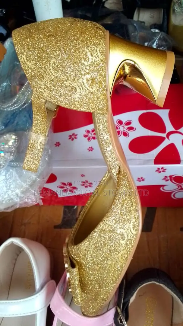 Gold High Heeled Shoe