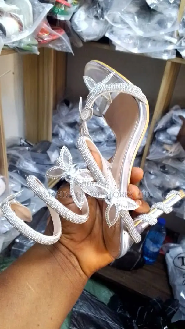 Ladies White Heeled Shoes With Intricate Design