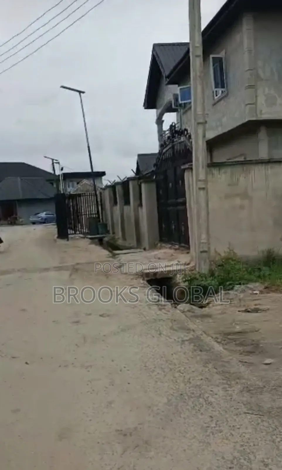 A Land of 100/100 on Tiled Road at Nigercat Warri for Sale